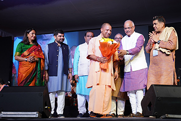 Uttar Pradesh Chief Minister Yogi Adityanath, who graced the occasion and received a warm felicitation with a bouquet. 